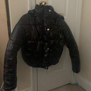 Jacket comes in a petite size (2). Brand new with tags, this jacket is hooded.